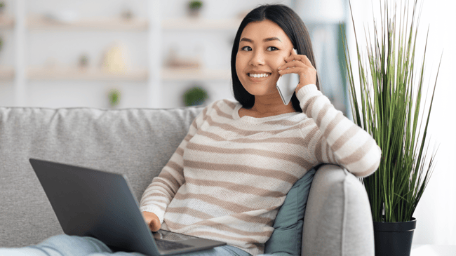 young parent on phone with teacher