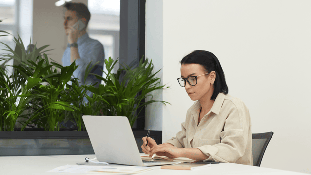 enrollment marketer working on laptop