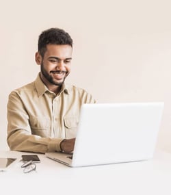 seated man using computer