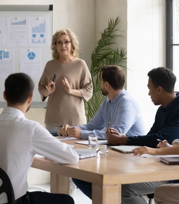 Blog-Images-01272022 a woman explains to three people how to improve their mental fitness