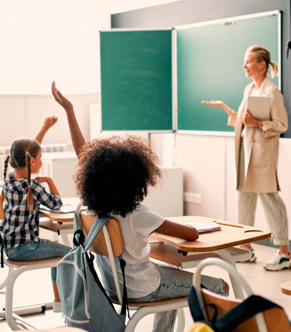 Blog-Images-121721 teacher speaking to multiracial students