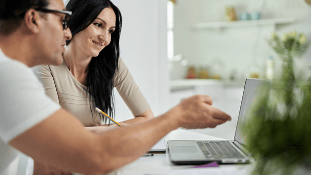 two parents looking at school online