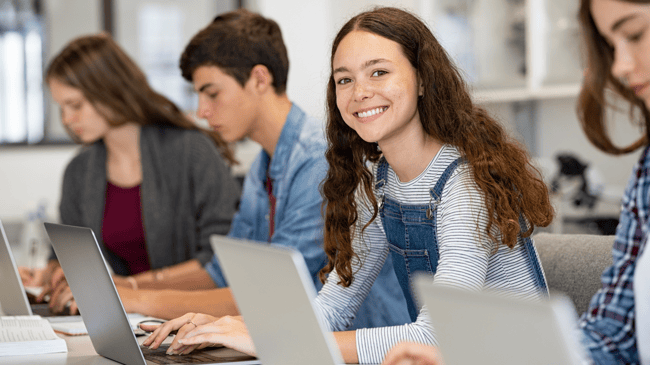 happy student working at a computer