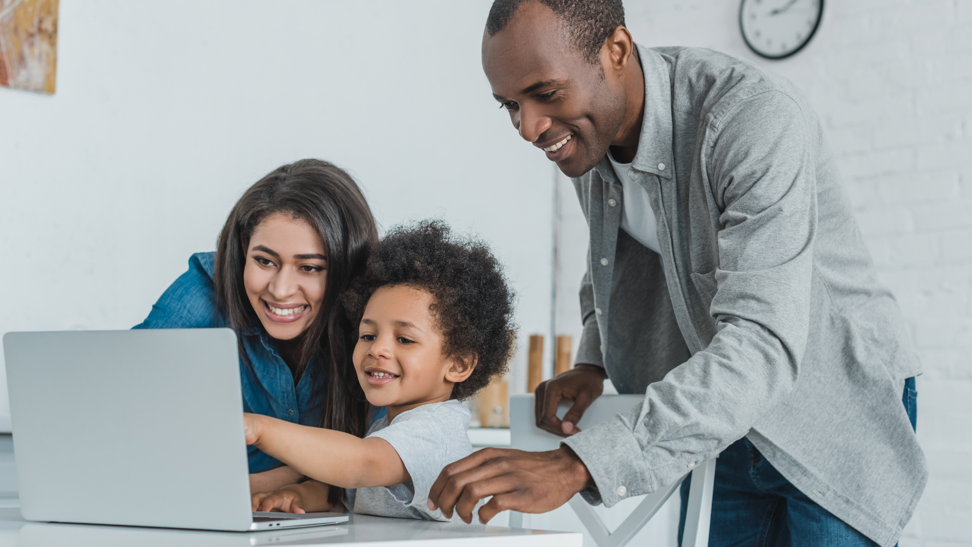 african-american-parents-and-son-using-laptop-at-h-2021-09-03-14-16-22-utc