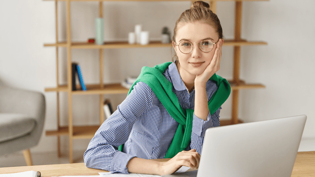 young teacher at laptop 