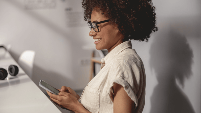 black woman using her phone