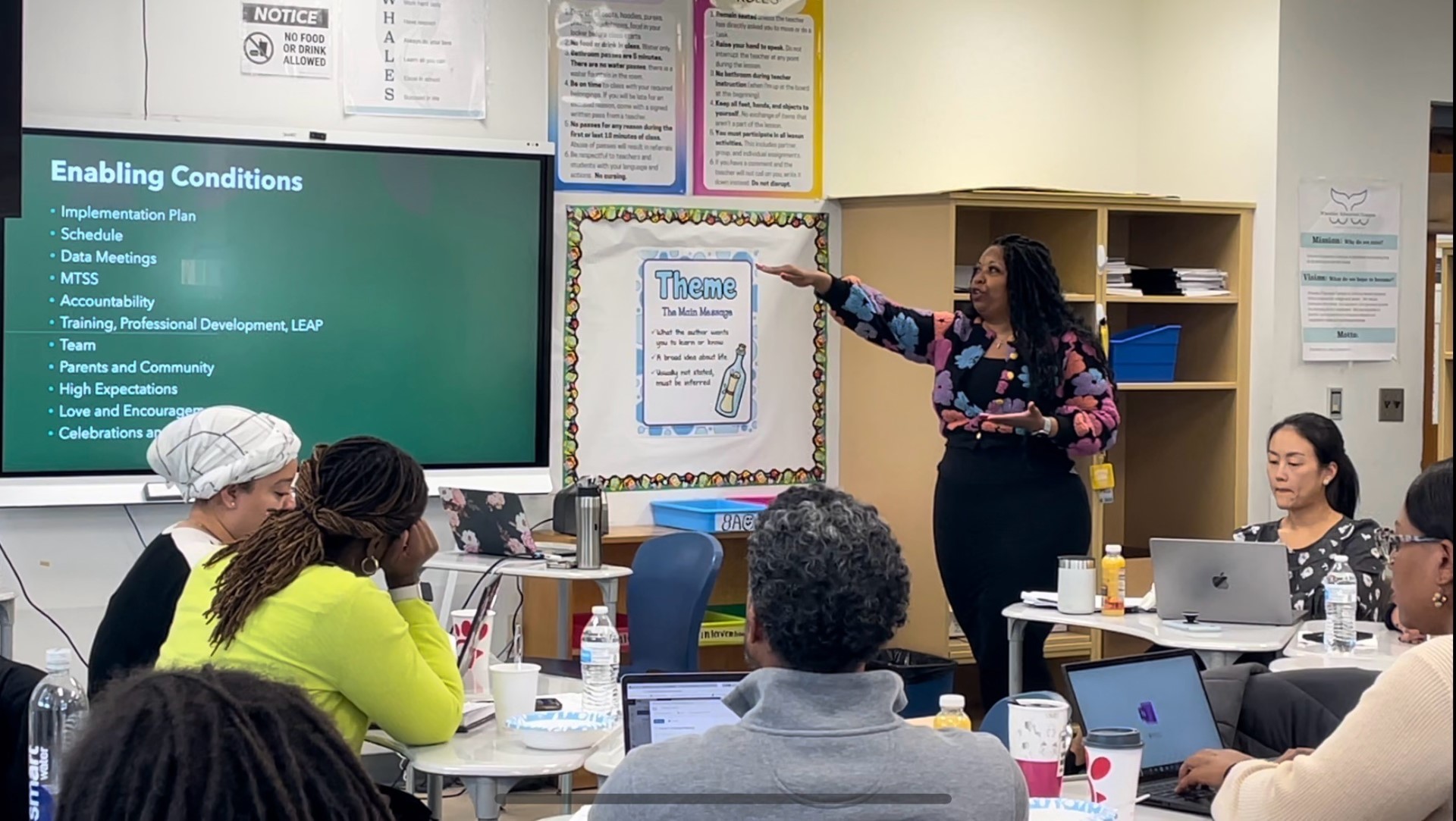 dr tenia pritchard leading a meeting with her school leaders