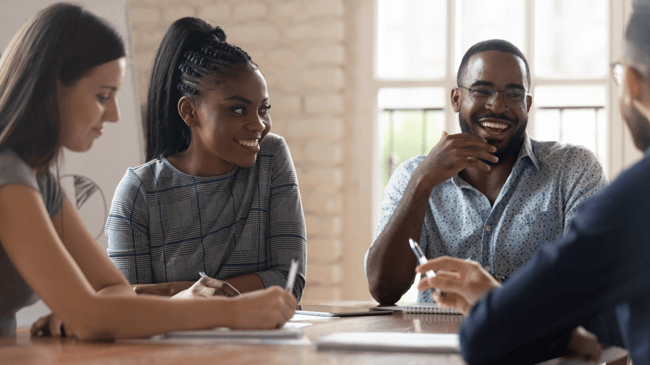 three people interviewing a teacher candidate