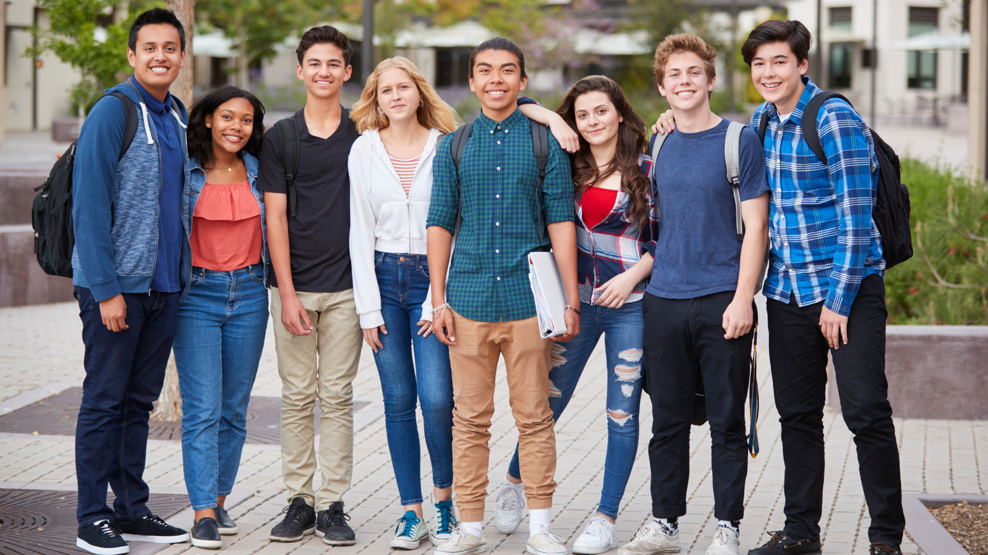 group of happy smiling student ambassadors for a school