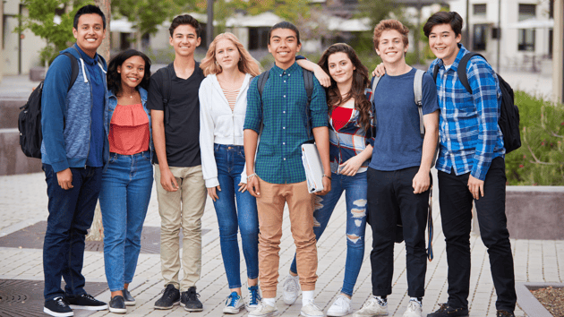 portrait-of-high-school-students-outside-school