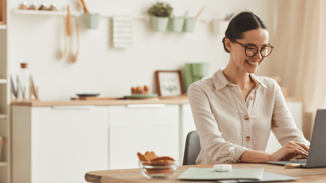 smiling-young-woman-working-from-home-2022-02-02-03-59-43-utc