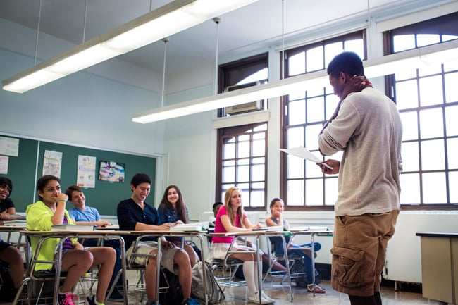 students-looking-at-teenage-boy-reading-notes-in-c-2022-03-09-02-30-24-utc