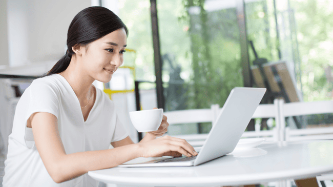 woman creating a school communication plan on her computer