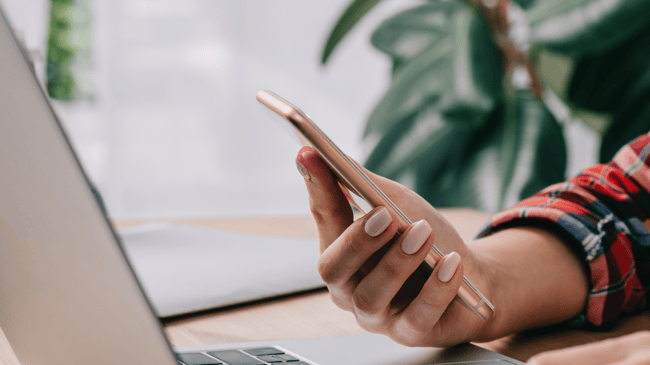 woman holding phone in hand