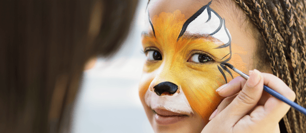 young girl getting face painted student recruitment fair