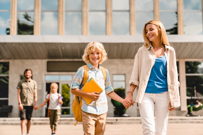 young-parents-escorting-their-kids